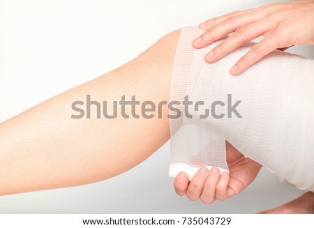 Injured female Thigh . Legs is bandaged with plaster.Selective focus,Human health care and medicine concept.