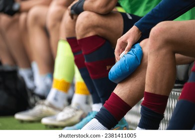 The injured footballer lies on the pitch. - Powered by Shutterstock