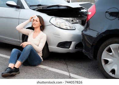 Injured girl after car accident in the street