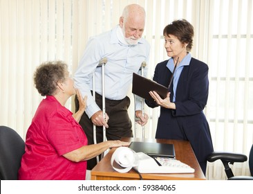 Injured Man And His Wife Meet With A Personal Injury Lawyer.