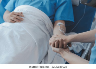 Injured patient showing doctor broken wrist and arm with bandage in hospital office or emergency room. Sprain, stress fracture or repetitive strain injury in hand. Nurse helping customer. First aid. - Shutterstock ID 2305181035