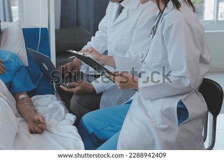 Similar – Doctor giving a prescription to senior patient