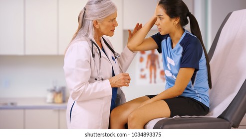 An injured soccer player goes to the doctors office for help - Powered by Shutterstock