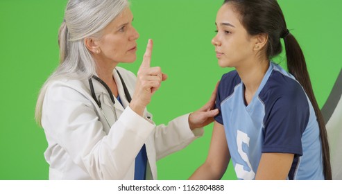 An Injured Soccer Player Is Tested For A Concussion On Green Screen