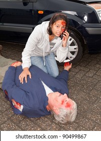 Injured Woman Calling For An Ambulance After A Car Accident