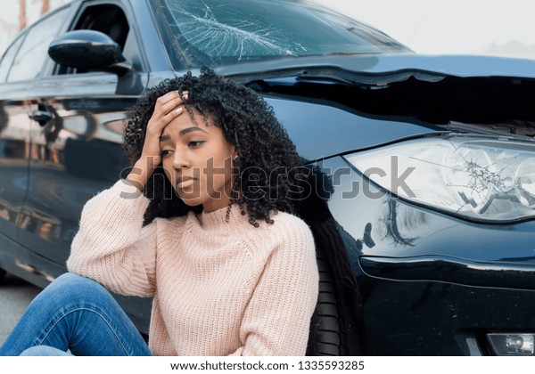 Injured woman\
feeling bad after having a car\
crash