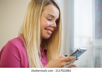 Injured Woman With Scar On Face Using Mobile Phone For Communication. Domestic Violence Survivor With Facial Scars Typing Message In Social Media App On Smartphone. Abuse Victim Living Happy Life