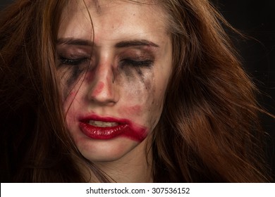 Injured Woman With Smeared Makeup