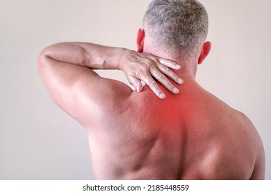 Injury Of The Cervical Spine, A Man With Back Pain At Home. Myalgia, Arthritic Joint Pain