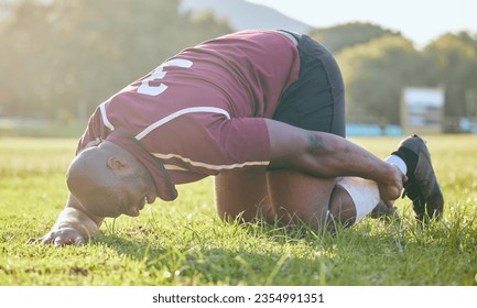 Injury, leg pain and black man, sports athlete or rugby player with joint fatigue from accident, training workout or exercise. Game, body burnout and African person sore, hurt and broken bone risk - Powered by Shutterstock