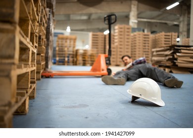Injury at work. Warehouse worker after an accident in a warehouse.