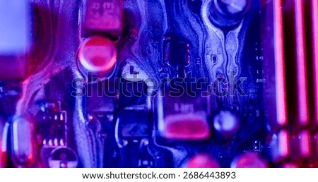 Ink spill. Processor chip. Blur blue purple pink color digital texture acrylic glitter liquid motherboard on abstract electronic art background.