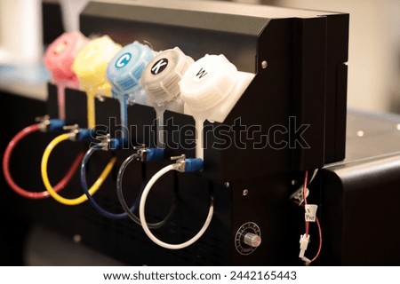 Ink supply unit of big format inkjet printer closeup. Selective focus.