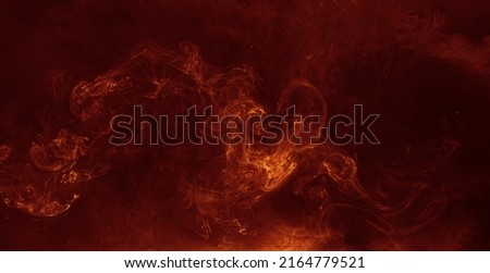 Ink water blend. Hellfire effect. Red orange fiery fluid mixing motion on black mist texture abstract background shot on Red Cinema camera 6k.