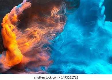 Ink Water Mix. Magic Burst. Blue Orange Paint Blend. Abstract Art Background.