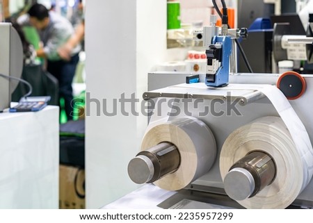 Inkjet print head component of continuous label or graphics printer machine during print sticker sheet for manufacturing process in industrial