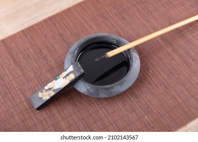 Inkstone And Brush With Ink