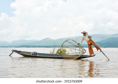 Inle lake, Myanmar,October 17 2014: Myanmar travel attraction landmark - Traditional Burmese fisherman at Inle lake, Myanmar famous for their distinctive one legged rowing style