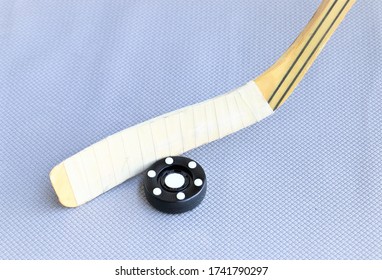 Inline Hockey Puck And Hockey Stick On Grey Background