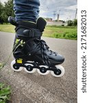 inline skates and road tree