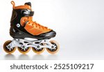 Inline skates or rollerblades roller blade are a type of roller skate four 4 wheels in a single line with ball bearing castors. Isolated on white background with copy space