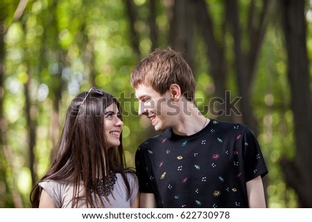 Inlove couple taking a walk in the forest. Lifestyle and relationship. Young inlove boyfriend and girlfriend