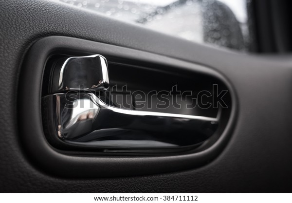 Inner door\
handle, modern car interior\
detail