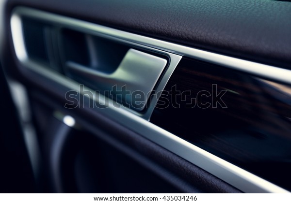 Inner door\
handle, modern car interior\
detail