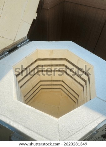 the inner lining of refractory bricks in a small pottery kiln