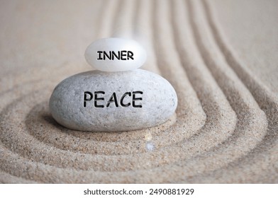 Inner peace text engraved on Zen stone on sand with shining. Inner peace concept. - Powered by Shutterstock