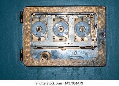 Inner workings of an antique bank safe. Triple Clock Vault Door.