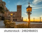 Inner yard of the Montserrat monastery, abbey of the Order of Saint Benedict Monastery of Montserrat at sunrise in Catalonia, Spain. Main square in Montserrat monastery