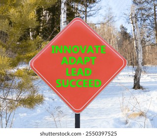 Innovate adapt lead succeed symbol. Concept words Innovate Adapt Lead Succeed on beautiful red road sign. Beautiful winter forest background. Business innovate adapt lead succeed concept. Copy space - Powered by Shutterstock