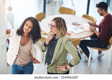 Innovate Before Its Too Late. Shot Of Young Businesspeople In The Office.