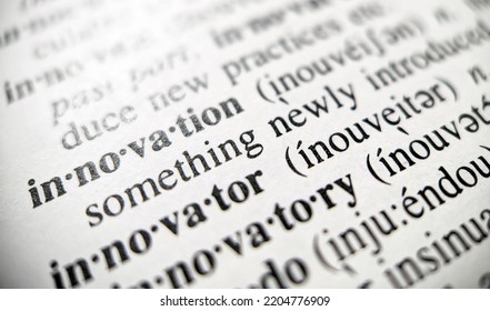 Innovation dictionary definition with closeup view of text on book paper with focus blur effcect - Shutterstock ID 2204776909