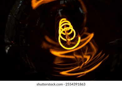 Innovation and energy concept. Close up glowing light bulb. Close-up of incandescent light bulbs. Inefficient filament light bulbs. Electricity. Decorative edison light bulbs. - Powered by Shutterstock