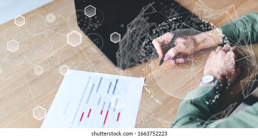 Innovation graphs interfaces. worldwide connection virtual hologram. Minimalist workplace with laptop, notepad on the wooden table. Woman writing notes in diary. Top view. Faded and blurred background - Powered by Shutterstock - Get 15% off with code: PIKWIZARD15