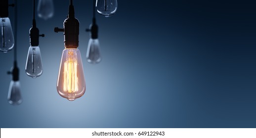 Innovation And Leadership Concept - Glowing Bulb On Among Bulbs Off
