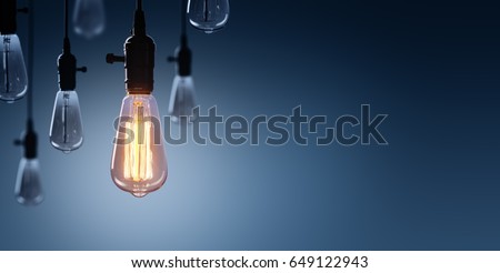 Innovation And Leadership Concept - Glowing Bulb On Among Bulbs Off
