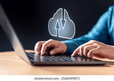 innovation, security, computing, database, job, link, networking, report, system, server. A person is typing on a laptop with a cloud icon on the screen. The cloud icon has arrows pointing to it.