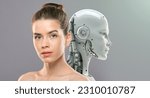 Innovations of beauty industry. Close up portrait of young gorgeous lady with perfect face and skin posing to camera with artificial robot, grey studio background, free space