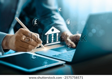 Innovative Digital Banking Interface Showcasing Global Currency Exchange and Cryptocurrency Symbols on a Tablet and Laptop, Representing Financial Technology Trends and the Cashless Economy Future