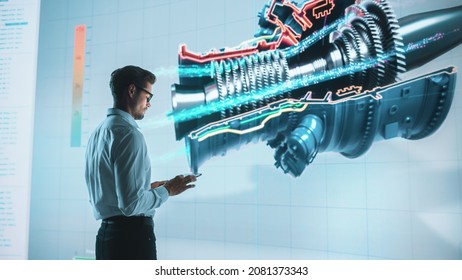 Innovative Green Energy Startup: Engineer Designing Engine Using Tablet Computer and Big Wall Screen to Analyse Prototype. Concept for Sustainable Environmnetally Friendly Zero Emissions Turbine - Powered by Shutterstock