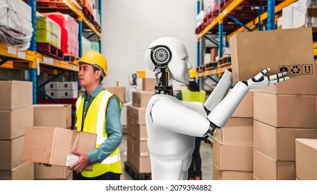 Innovative Industry Robot Working In Warehouse Together With Human Worker . Concept Of Artificial Intelligence For Industrial Revolution And Automation Manufacturing Process .