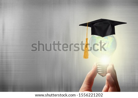 Innovative learning, creative educational study concept for graduation and school student success with world lightbulb on teacher chalkboard