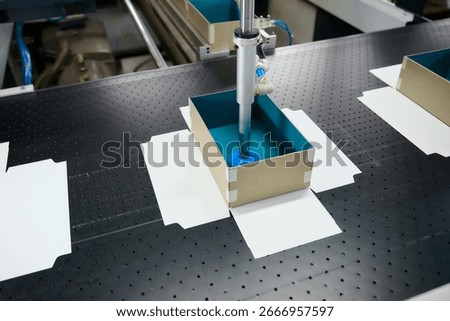 Innovative robotic process transforms cardboard box assembly in a state-of-the-art manufacturing plant