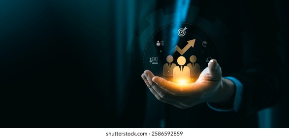 Innovative Training and Development Concept Depicting a Businessman's Hand Holding Digital Icons Representing Workforce Growth, Skills Improvement, and Strategic Success