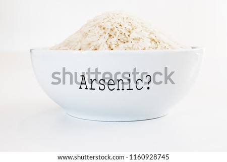 Inorganic Arsenic in rice - white bowl on white background
