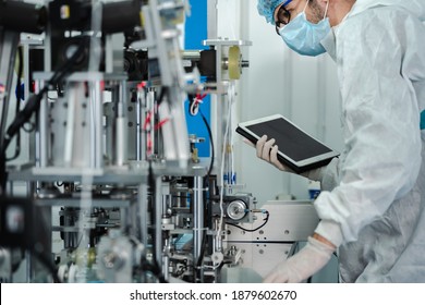 Inovation design engineer and doctor team Diverse industries Expert, Programming, and Robotic Hand Handling Bright hi-tech facility Scientists in sterile clothing working in laboratory.  - Shutterstock ID 1879602670