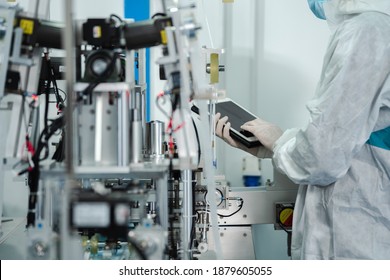 Inovation design engineer and doctor team Diverse industries Expert, Programming, and Robotic Hand Handling Bright hi-tech facility Scientists in sterile clothing working in laboratory.  - Shutterstock ID 1879605055